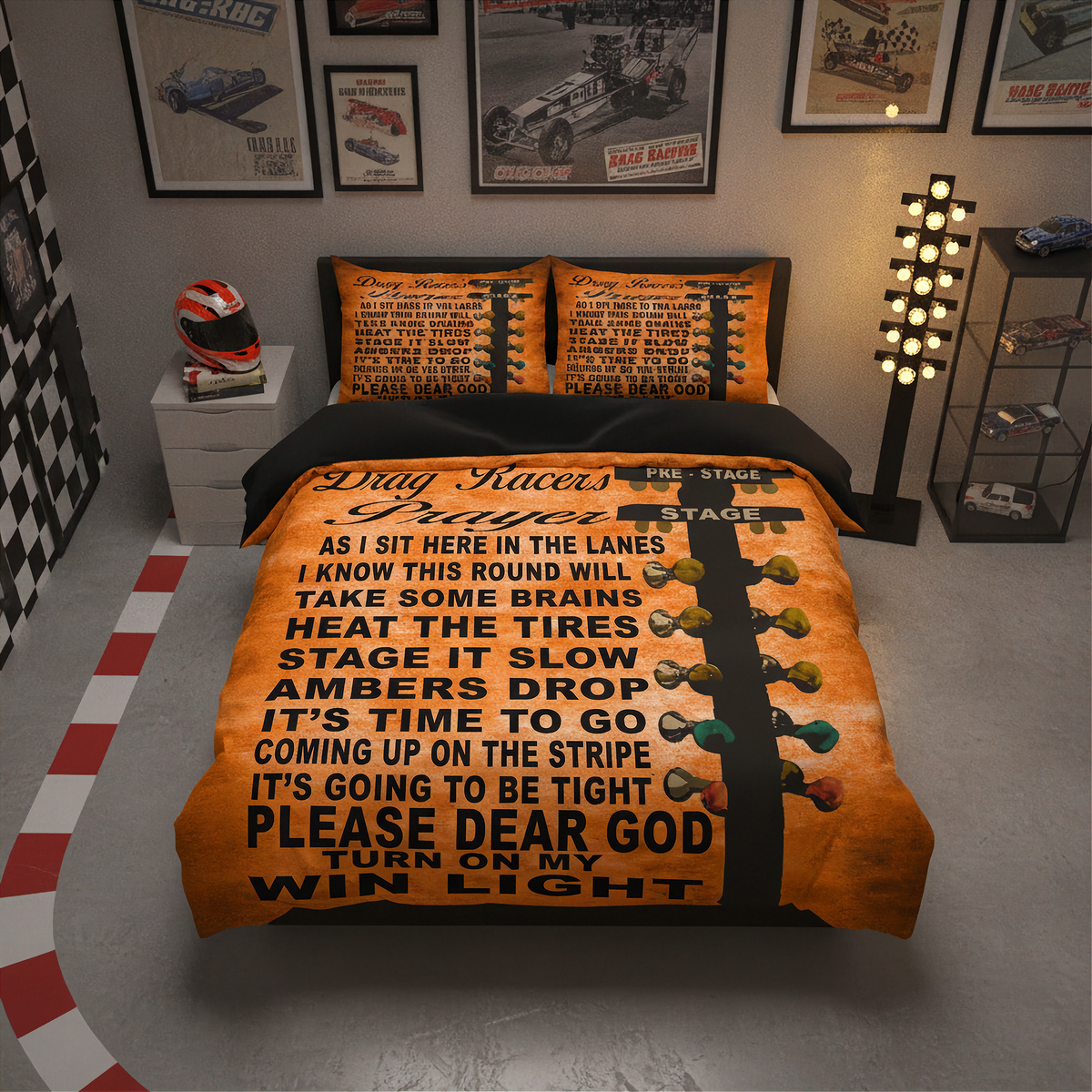 A racing-themed bedding set displayed on a bed in a styled bedroom. The set includes an orange and black duvet cover and two matching pillowcases featuring a black and white racing poem, a checkered pattern, and a graphic of racing lights.