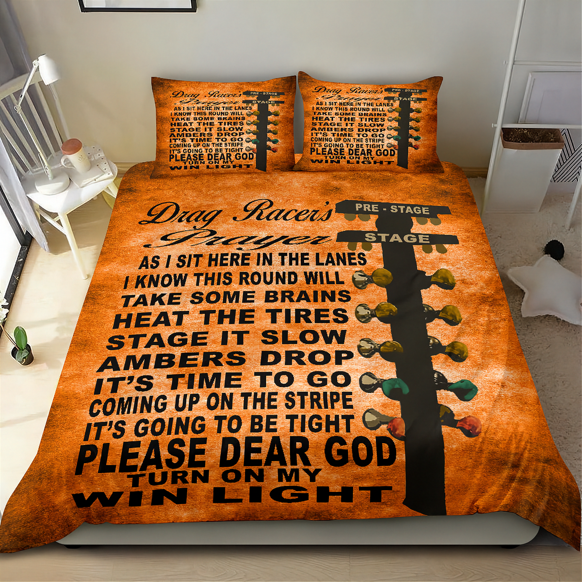 An orange drag racer themed bedding set featuring a duvet cover and two pillowcases with black text and a guitar headstock graphic, displayed on a bed in a bedroom setting.