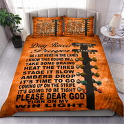 An orange drag racer themed bedding set featuring a printed graphic of a guitar headstock and a running text quote about drag racing, displayed on a bed in a styled bedroom setting.