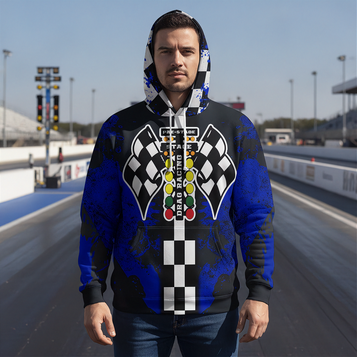 A man wearing hooded sweatshirt shown from the back, featuring a drag racing-themed graphic with black and white checkered flags, a vertical checkered stripe, and a multi-colored race light sequence on a blue and black distressed background.
