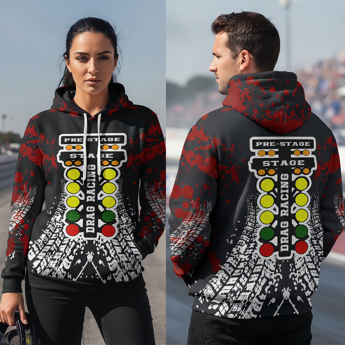 A man and woman standing on a racetrack wearing a black hoodie with a red hood and a large drag racing graphic on the back and front, featuring a light bar, racing lights, and tire tracks.