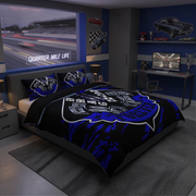 A racing-themed bedding set featuring a black duvet cover and matching pillowcases with a blue and white engine graphic and 'Quarter Mile Life' text, styled in a modern blue bedroom with car and track wall decals.