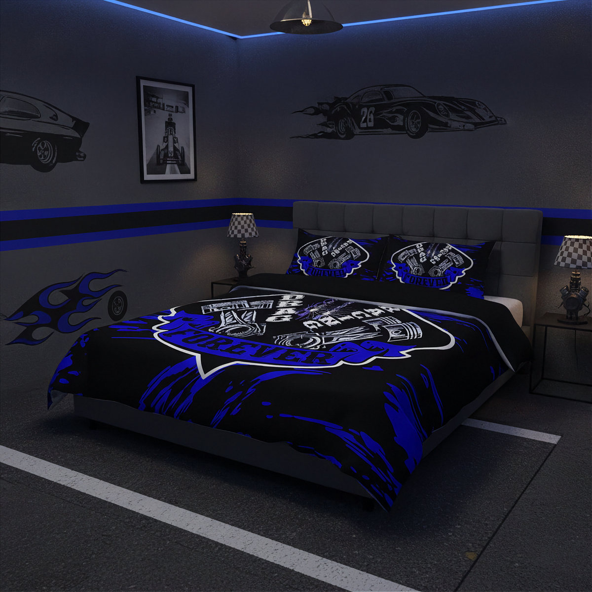 A racing-themed bedding set featuring a black comforter and matching pillowcases with blue and white graphics, styled in a dark gray bedroom with car decals and blue ambient lighting.