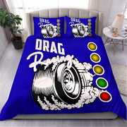 A blue bedding set with a bold drag racing graphic, including a duvet cover and two matching pillowcases, displayed on a bed in a styled bedroom setting.
