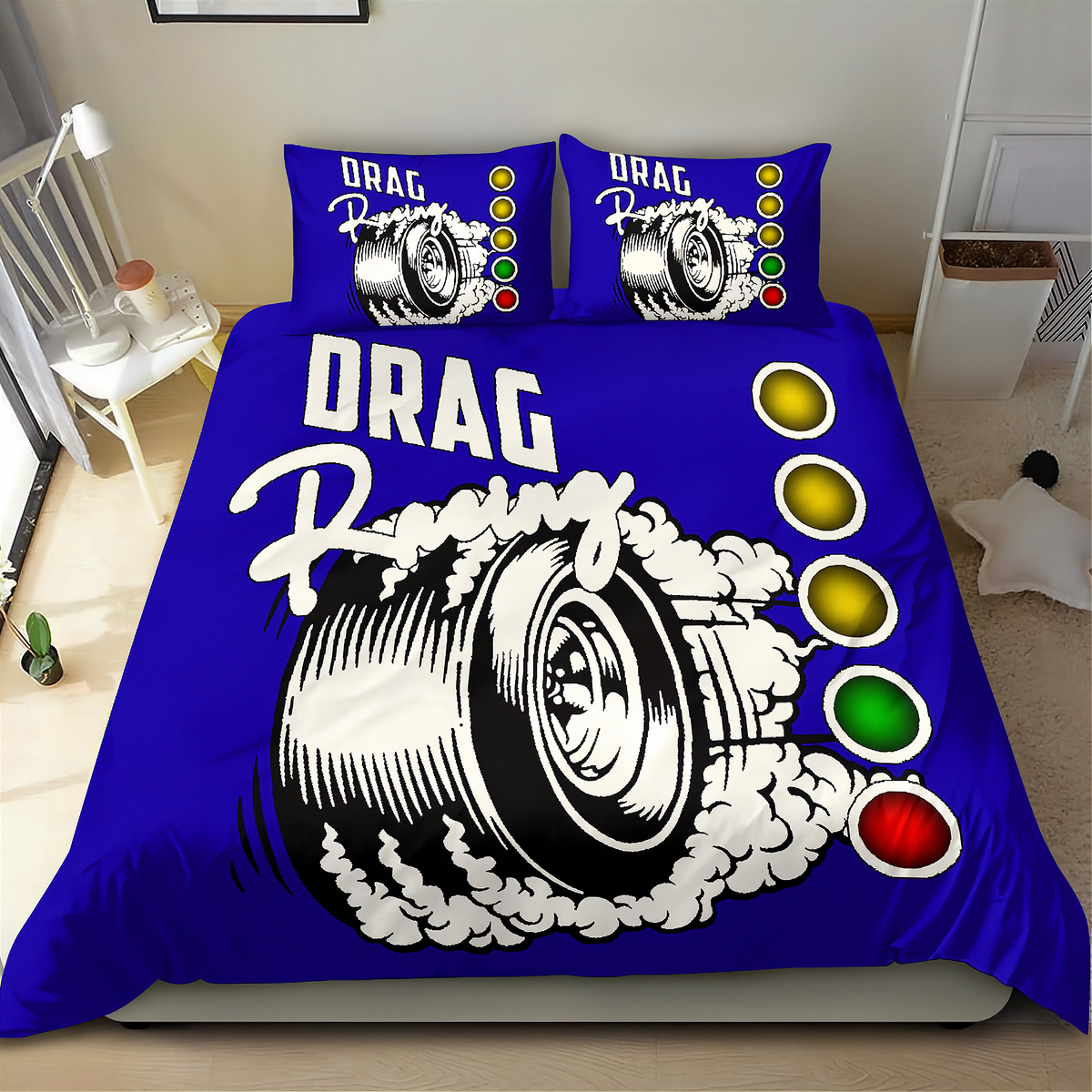 A blue bedding set with a drag racing graphic, including a duvet cover and two matching pillowcases, displayed on a bed in a bedroom setting.