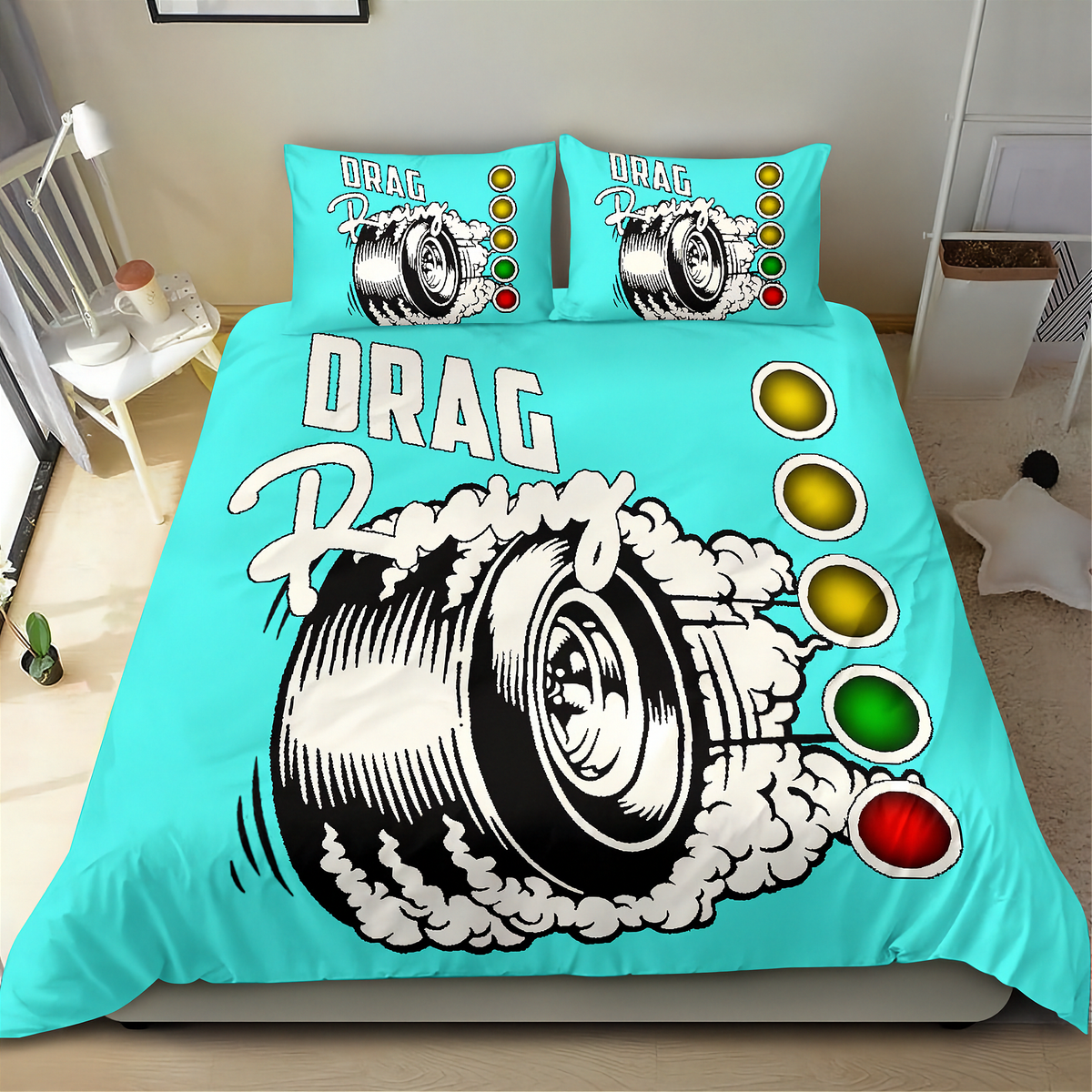 A turquoise drag racing themed bedding set featuring a large tire graphic with smoke and the words 'DRAG Racing', plus matching pillowcases, shown on a bed in a bedroom.
