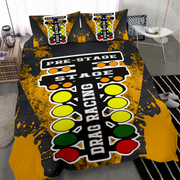 A bedding set featuring a duvet cover and two pillowcases with a drag racing track graphic, styled on a bed in a modern bedroom setting.
