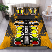 A bedding set featuring a duvet cover and two matching pillowcases with a drag racing start-line graphic, styled on a bed in a modern bedroom setting.