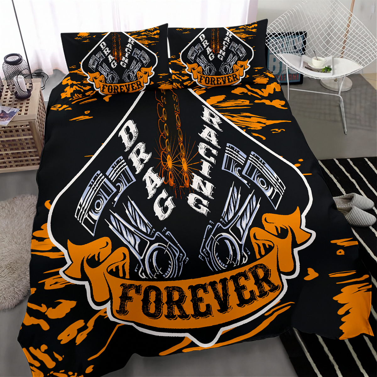 A black bedding set with a bold orange and white drag racing graphic, shown on a bed in a modern bedroom setting.