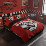 A racing-themed bedding set featuring a red duvet cover and matching pillowcases with a black and white tire graphic, styled in a red and black garage room setting.