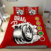 A red bedding set with a bold drag racing graphic, including a duvet cover and two matching pillowcases, displayed on a bed in a bedroom setting.