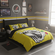 A racing-themed bedding set featuring a bright yellow duvet cover and matching pillowcases with a large black and white motorcycle graphic, styled in a modern gray bedroom with racing decor.