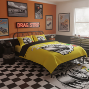 A racing-themed bedroom featuring a bed dressed in a bright yellow and black graphic duvet cover with matching pillowcases. The room has a black-and-white checkered floor, a black metal bed frame, an orange wall with framed drag strip posters, and a neon-style 'DRAG STRIP' sign.