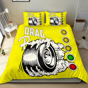 Bright yellow drag racing themed bedding set including a duvet cover and two pillowcases, featuring a large black and white tire graphic with smoke and traffic light illustrations.