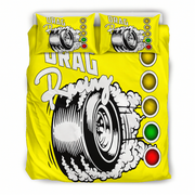Bright yellow bedding set with two matching pillowcases featuring a racing tire graphic, bold white 'DRAG Racing' text, and a vertical row of colored light circles in yellow, green, and red.