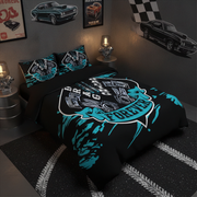 A bed dressed in a black bedding set with a large teal and white drag racing graphic reading 'DRAG RACING FOREVER,' shown in a styled bedroom with car posters, lamps, and a racing rug.