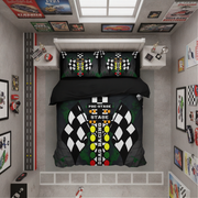 A top-down view of a racing-themed bedding set on a bed in a modern gray bedroom. The set includes a duvet cover and two pillowcases featuring a black and white checkered flag design, a vertical track graphic with yellow and red lights, and the words 'PRE-STAGE' and 'STAGE'.