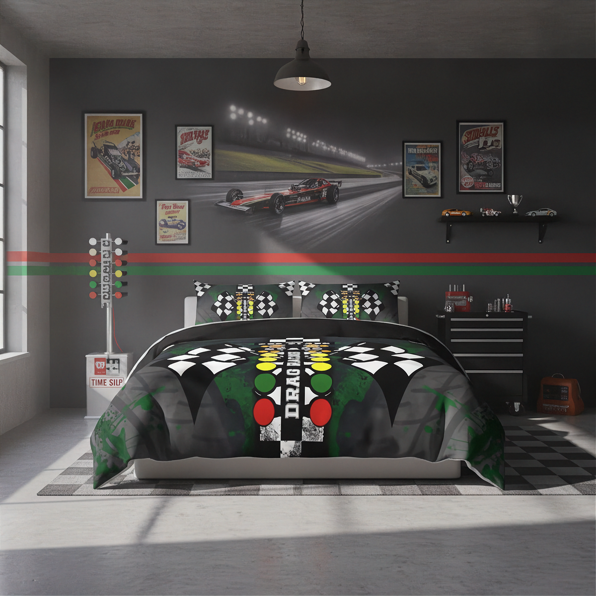 A racing-themed bedding set displayed on a bed in a modern, dark gray racing simulator themed bedroom. The comforter and matching pillowcases feature a black and white checkered pattern, a green and black track background, and illuminated green, yellow, and red race lights with the word 'DRAG' in the center.