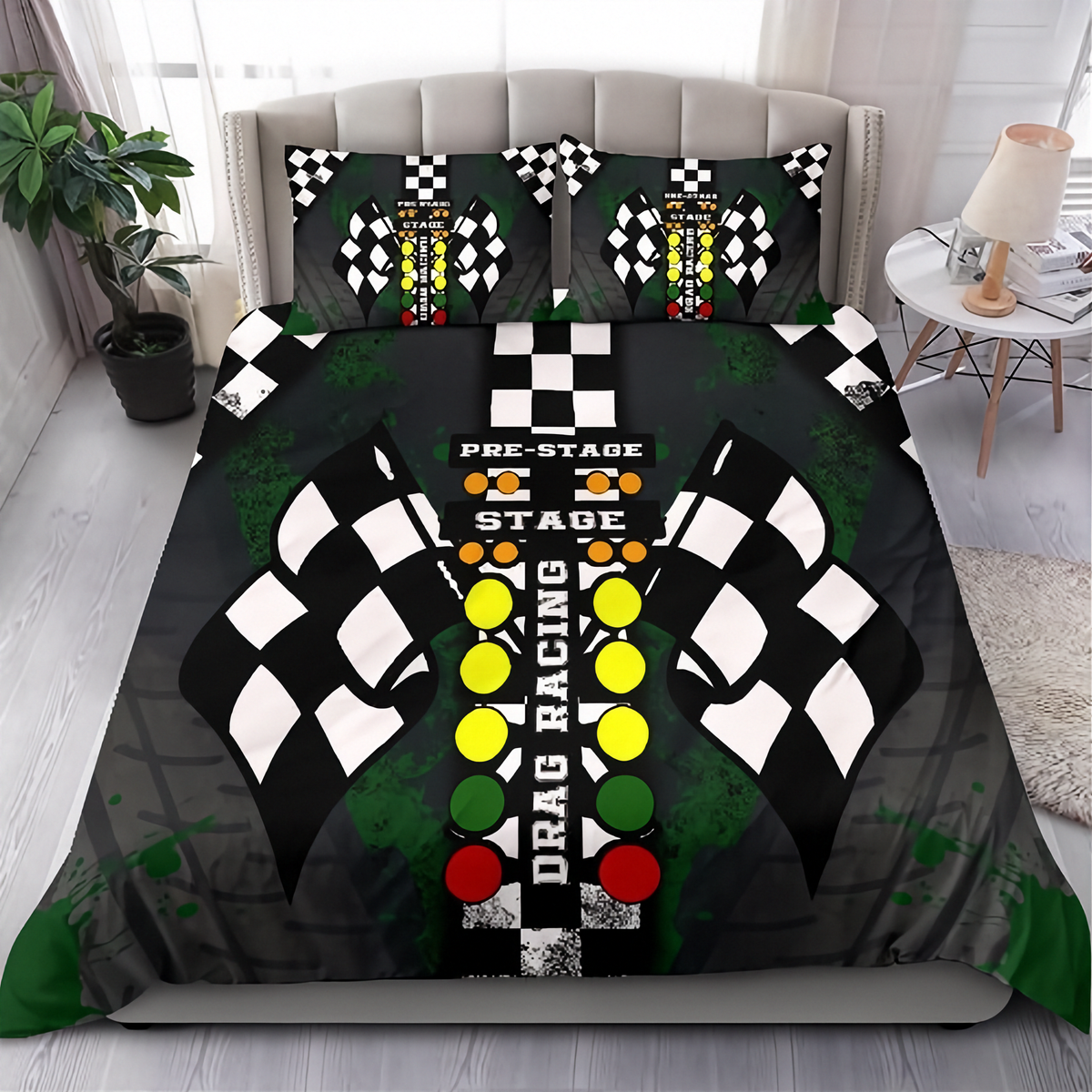 A racing-themed bedding set featuring a duvet cover and two pillowcases with a drag racing design. The design includes black and white checkered flags, a center line, racing lights, and green paint splatters on a dark gray background, shown on a bed in a styled bedroom setting.