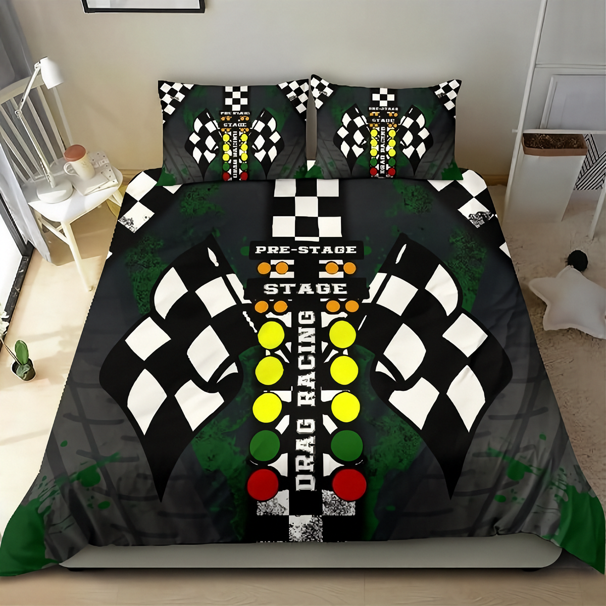A racing-themed bedding set featuring a duvet cover and two pillowcases with a drag racing track design, checkered flags, and colorful buttons on a black background, shown on a bed in a bedroom setting.