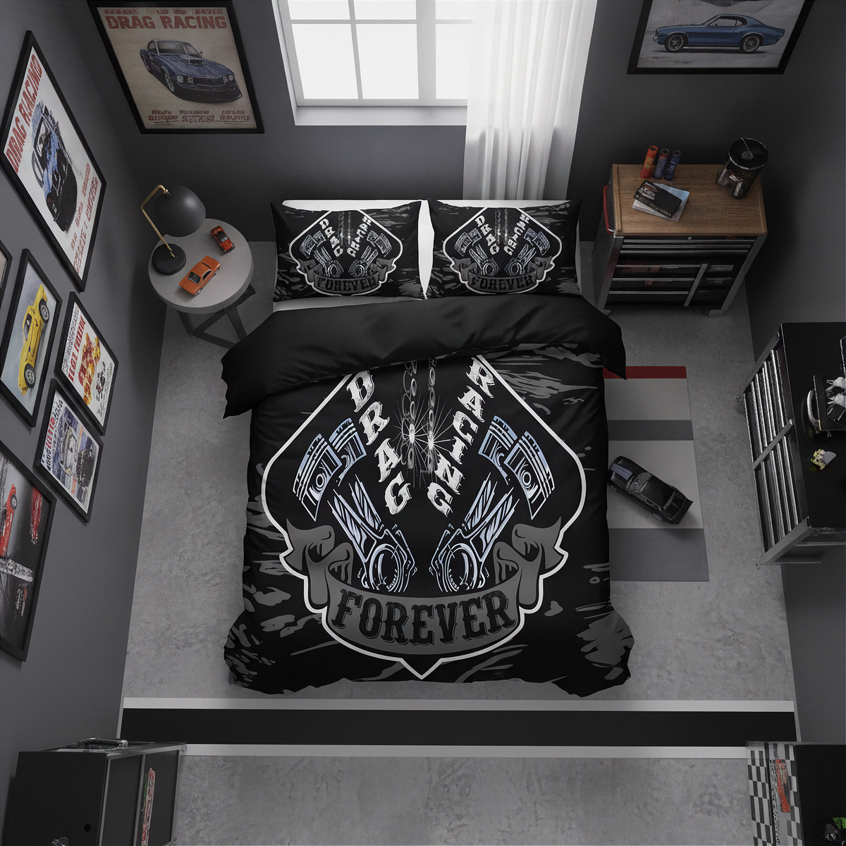 A top-down view of a black drag racing themed bedding set in a modern gray bedroom. The set includes a duvet cover and two pillowcases, both printed with a detailed white and gray engine graphic and the words 'DRAG RACING FOREVER'.