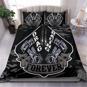 A black bedding set with a large racing graphic featuring pistons, chains, and the words 'DRAG RACING FOREVER' on the comforter and matching pillowcases, shown on a bed in a styled bedroom setting.