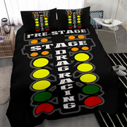 A black bedding set with a racing track and traffic light design, featuring two matching pillowcases in a modern bedroom setting.