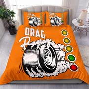 Bright orange drag racing themed bedding set including a duvet cover and two pillowcases, displayed on a bed in a modern bedroom setting.