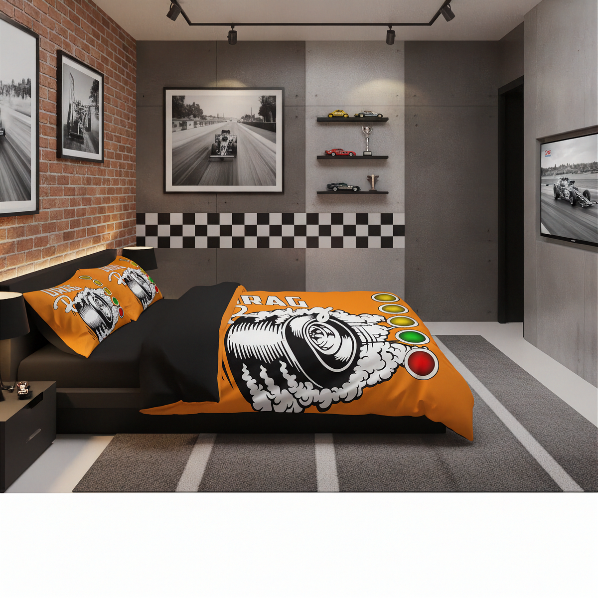 A racing-themed bedding set displayed on a bed in a modern, dark-themed bedroom. The set features a vibrant orange duvet cover and matching pillowcases decorated with a black and white tire graphic, the word 'RACER', and racing light bulbs.