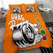 Bright orange bedding set with a drag racing graphic, including a duvet cover and two matching pillowcases, styled in a modern bedroom setting.