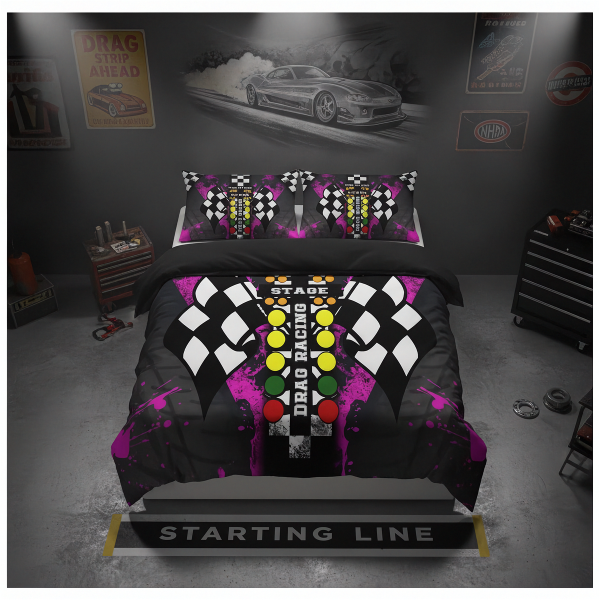 A racing-themed bedding set featuring a duvet cover and two pillowcases with a black, white, and purple checkered flag design, a central green, yellow, and red light bar motif, and the words 'STARTING LINE' printed across the front. The set is displayed on a bed in a dark gray garage-style bedroom setting with racing car wall art and tool chests.