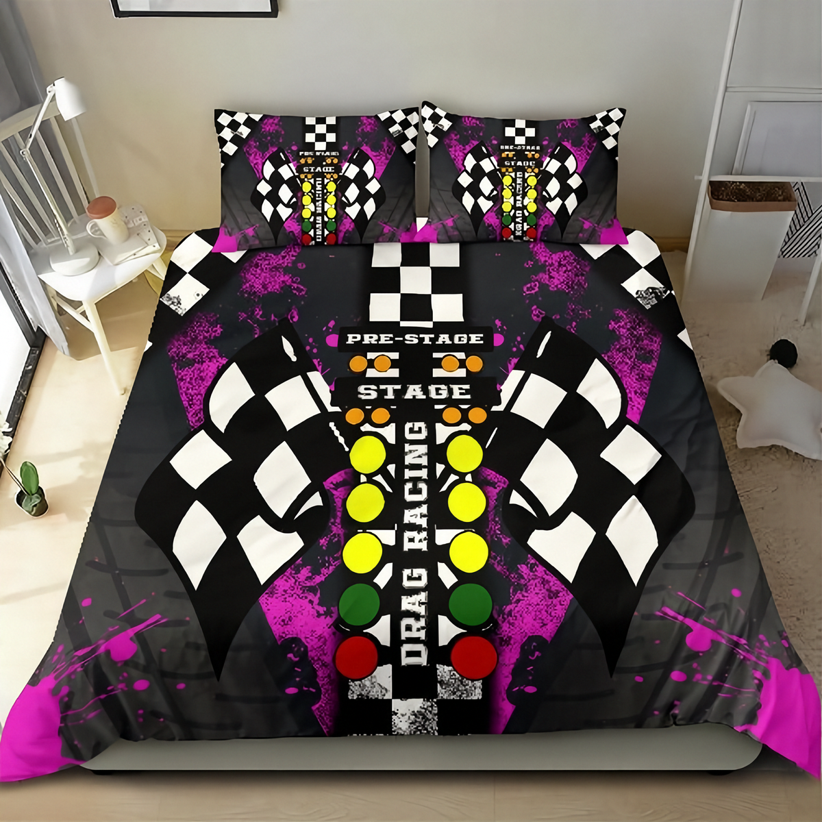 A bedding set featuring a duvet cover and two matching pillowcases with a drag racing theme. The design includes black and white checkered flags, a central vertical bar with yellow, green, and red lights, and the words 'PRE-STAGE', 'DRAG RACING', and 'STAGE' on a black background with bright pink paint splatters.