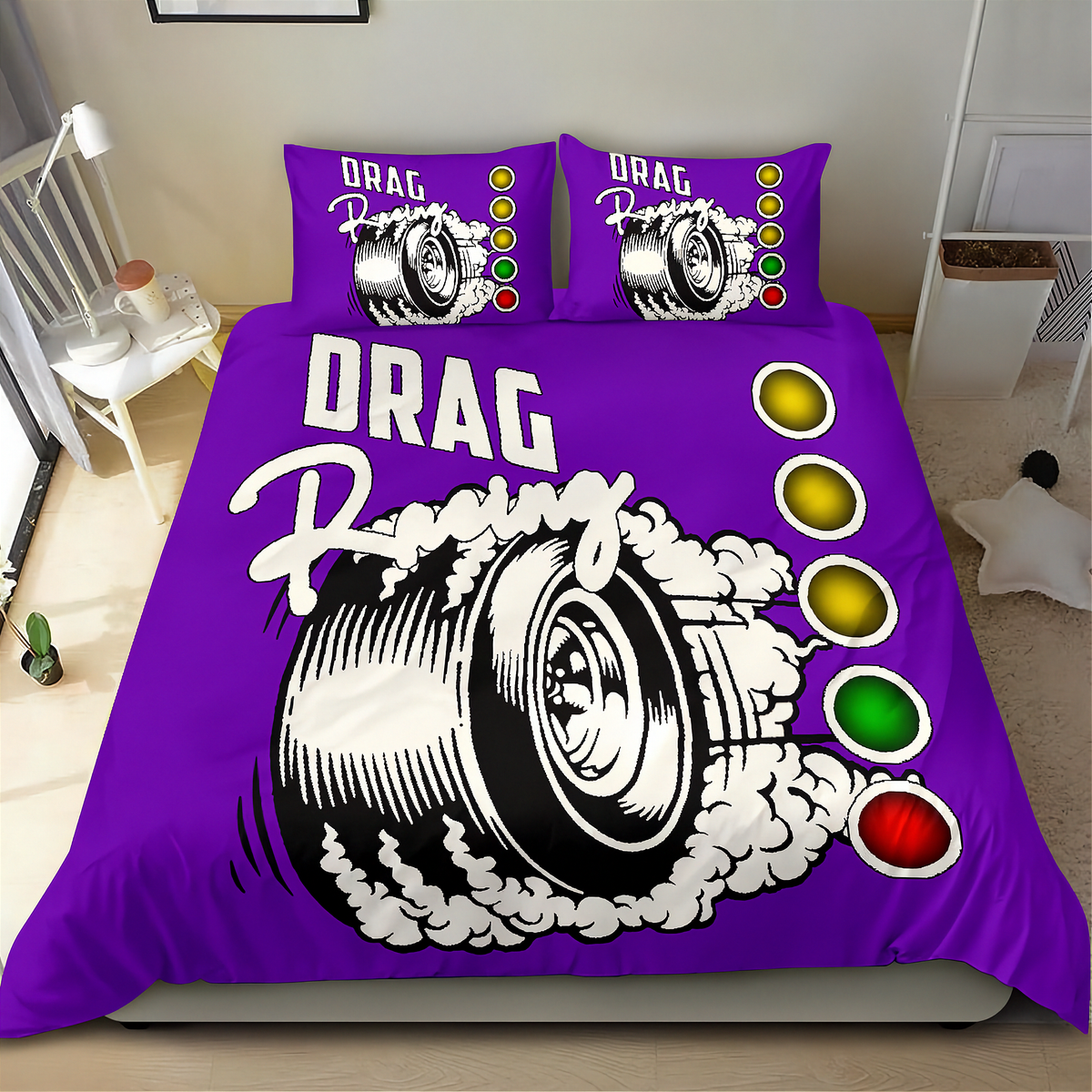 A purple drag racing themed bedding set including a duvet cover and two matching pillowcases, displayed on a bed in a bedroom setting. The design features a large black and white tire graphic with white smoke, the words 'DRAG Racing', and a vertical sequence of yellow, gold, green, and red traffic light circles.