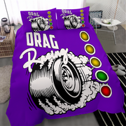 A purple drag racing themed bedding set featuring a large graphic of a spinning race tire with smoke and the words 'DRAG Racing', plus three matching pillowcases, shown on a bed in a modern bedroom setting.