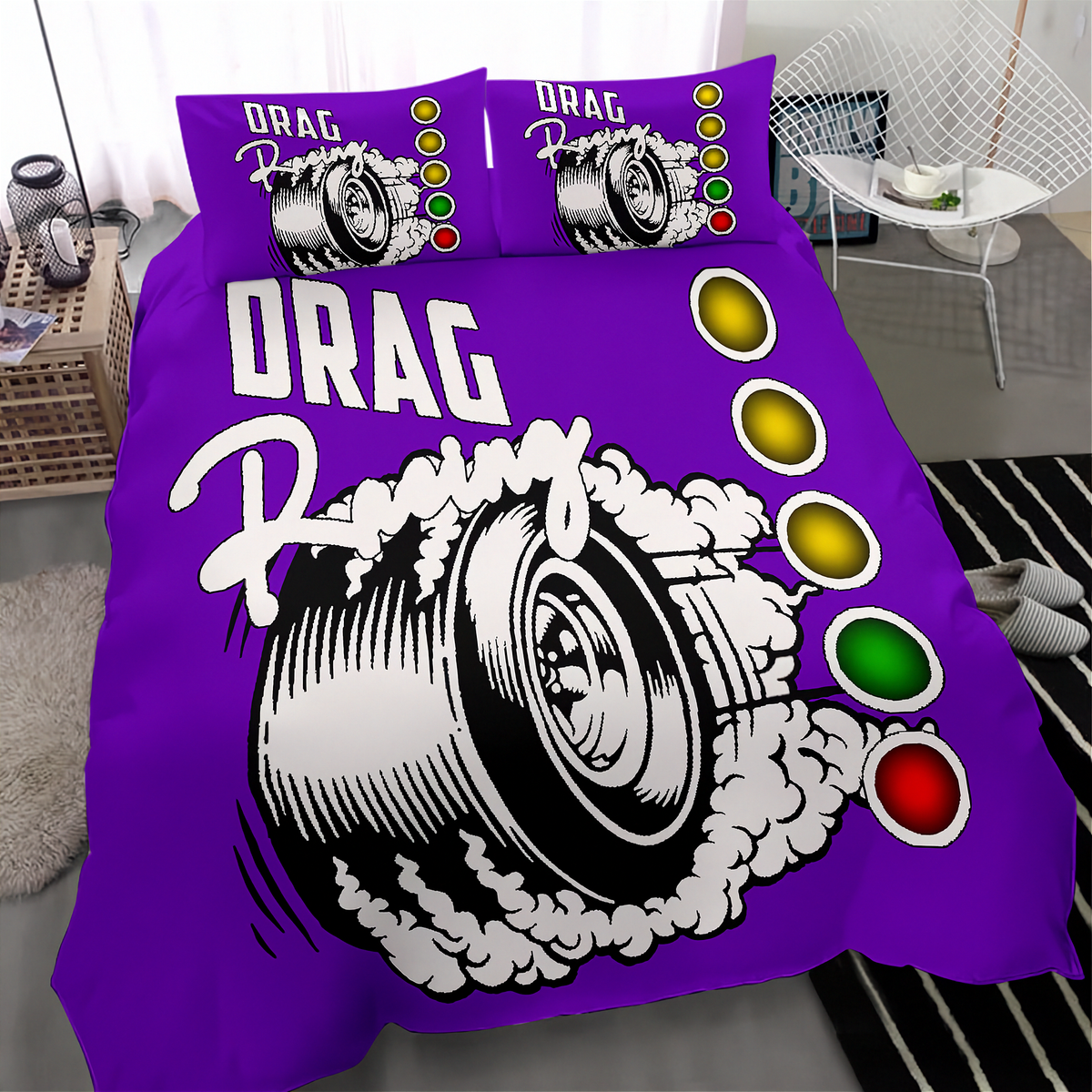 A purple drag racing themed bedding set featuring a large graphic of a spinning race tire with smoke and the words 'DRAG Racing', plus three matching pillowcases, shown on a bed in a modern bedroom setting.