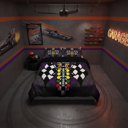 A racing-themed bedding set displayed on a bed in a garage-style bedroom. The comforter and matching pillowcases feature a black and white checkered flag pattern, a central green, yellow, and red race track strip, and the words 'DRAG RACING' and 'STAGE'.