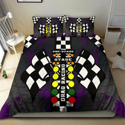A bedding set featuring a duvet cover and two pillowcases with a drag racing theme, displayed on a bed in a bedroom. The design includes black and white checkered flags, a center line with yellow, green, and red lights, and the words 'PRE-STAGE', 'STAGE', and 'DRAG RACING'.