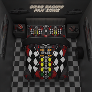 A top-down view of a drag racing themed bedding set in a dark gray bedroom. The set includes a duvet cover and two matching pillowcases featuring a checkered flag pattern, yellow and green track lights, and 'PRE-STAGE DRAG RACING' text.