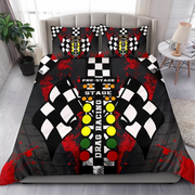 A bedding set featuring a duvet cover and two pillowcases with a drag racing theme, displayed on a bed in a styled bedroom. The design includes a black and white checkered flag motif, a drag racing control panel graphic with yellow, green, and red buttons, and red paint splatters on a black background.