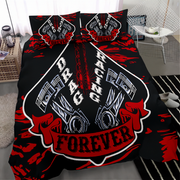 A black bedding set with a bold red and white drag racing graphic, featuring two matching pillowcases and a duvet cover with engine pistons and the words 'DRAG RACING FOREVER', shown on a bed in a modern bedroom setting.