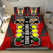 A bedding set featuring a duvet cover and two matching pillowcases with a drag racing start-line graphic, styled on a bed in a bedroom setting.