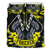 A bedding set featuring a duvet cover and two pillowcases with a bold 'Drag Racing Forever' graphic design. The design features metallic silver pistons, a chain, and yellow fists on a black background with yellow paint splatters.