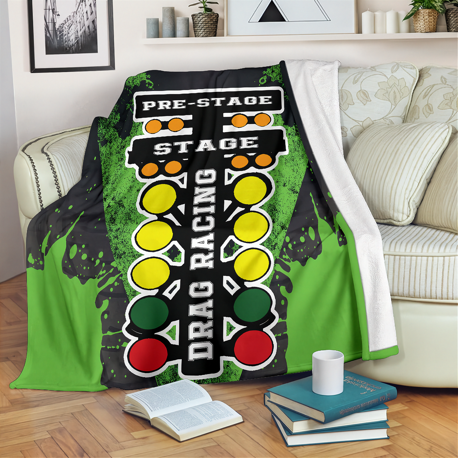 Drag racing themed blanket draped over a couch in a living room.