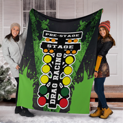 2 Women holding a green drag racing blanket