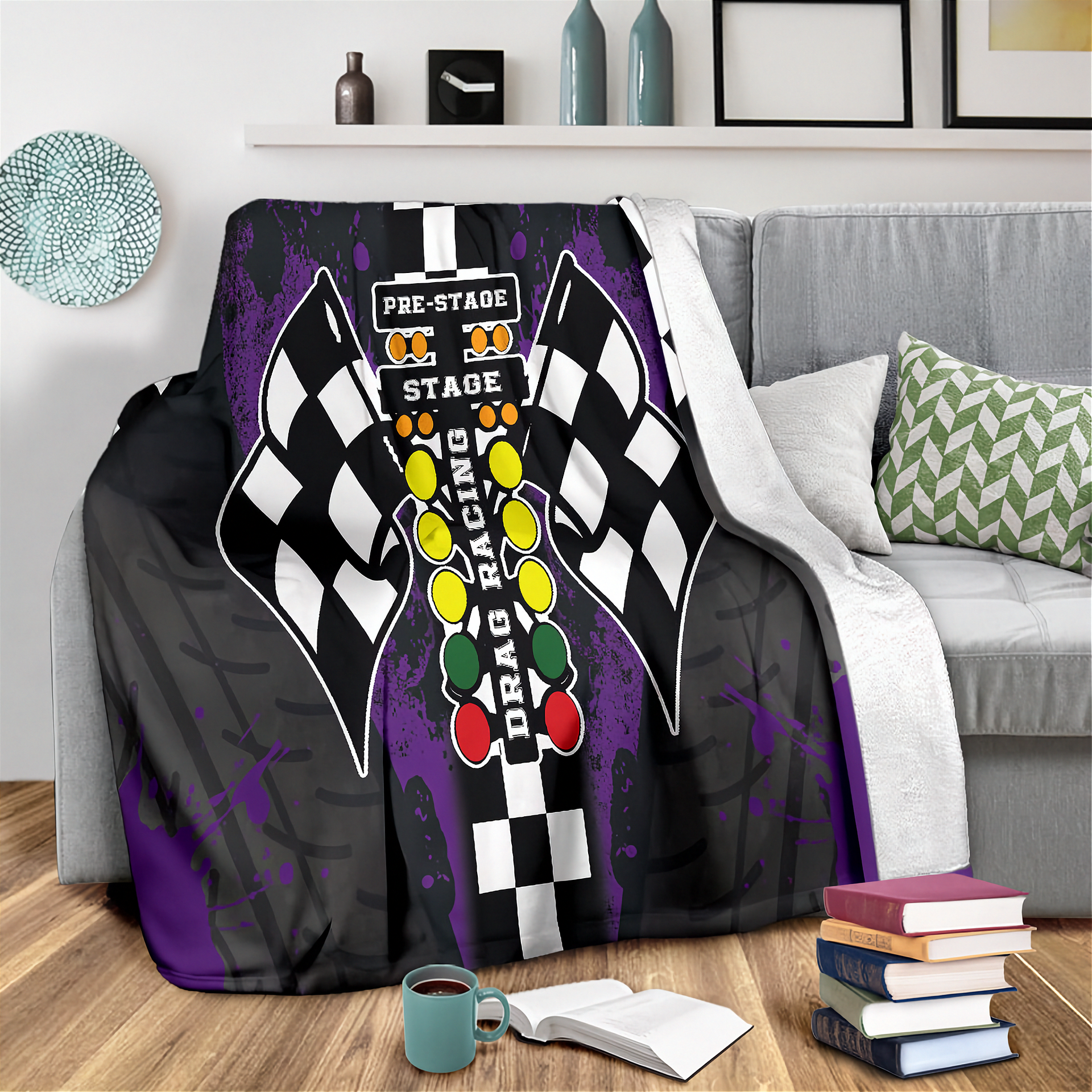 Decorative blanket with drag racing design on a couch in a living room setting