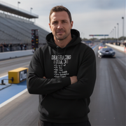 Man wearing a black hoodie with drag racing dad on a race track