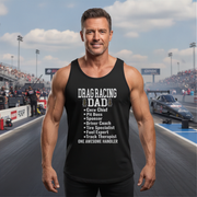 Man wearing a black tank top with 'Drag Racing Dad' text at a race track.