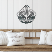 Decorative drag racing metal wall art above a wooden bench with pillows in a home setting.