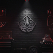 Metallic emblem with  drag racing on a black brick wall in a dimly lit room with tools.
