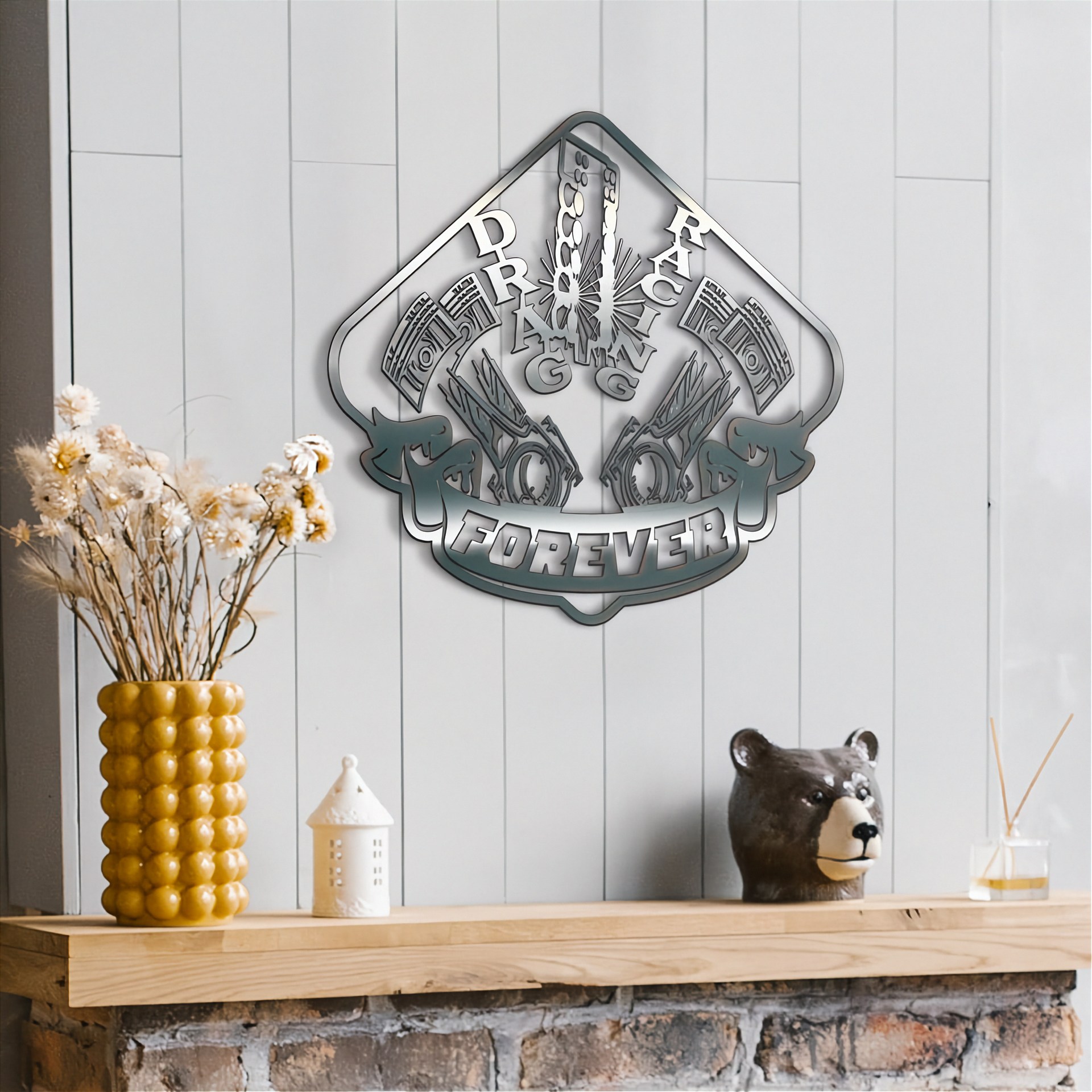 Decorative metal wall art with 'drag racing Forever' text on a wooden shelf with decorative items.